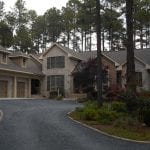 Stone house with custom roofing designed and laid down by Creed & Garner Roofing Company Inc. in Aberdeen, NC.